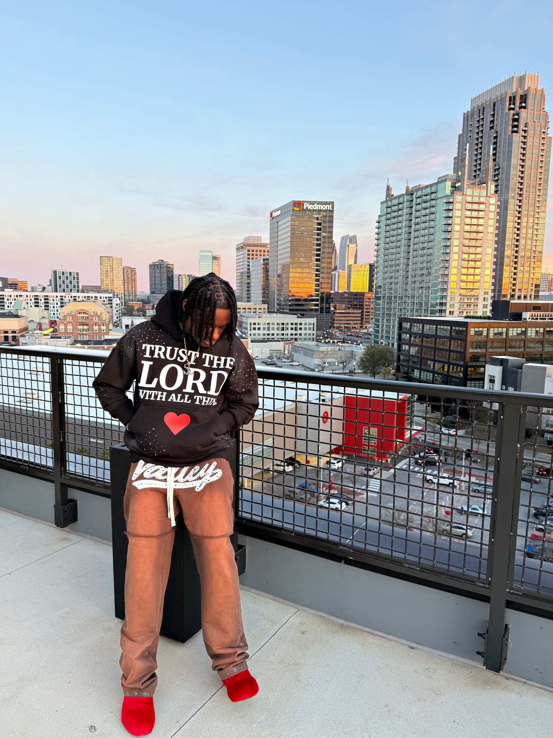 Mr. Strangeloots on a balcony — Atlanta, faith-driven hip-hop artist